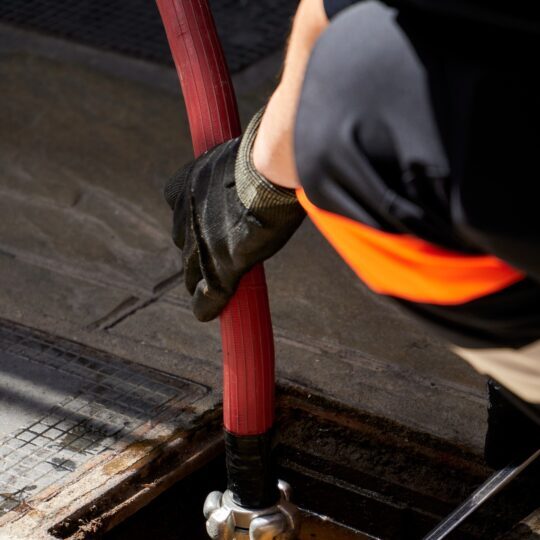 Firefighter connecting hose to a fire hydrant